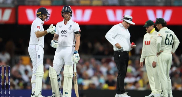 England's Ben Stokes and Joe Root interact