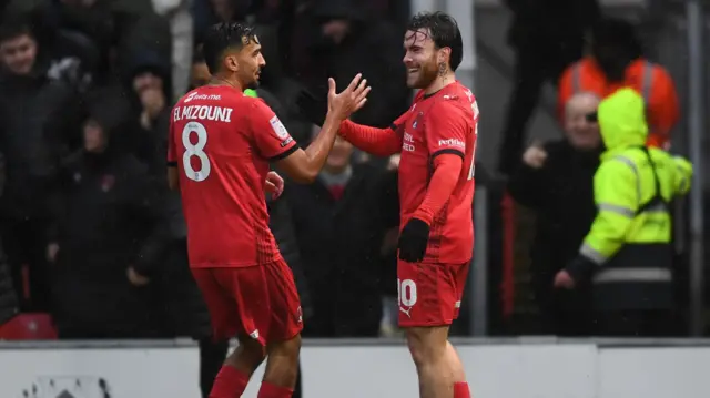 Aaron Connelly of Leyton Orient celebrates scoring with Idris El Mizouni