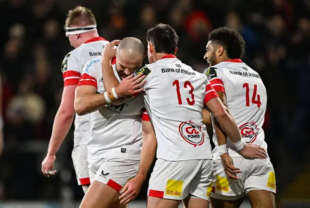 Jacob Stockdale celebrates his try