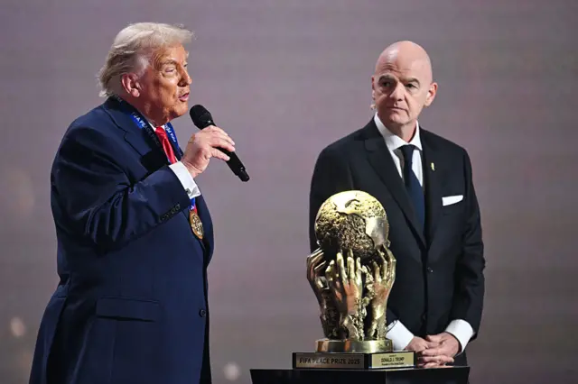 US President Donald Trump delivers his speech after receiving the FIFA Peace Prize from Italian Fifa President Gianni Infantino during the draw for the 2026 FIFA Football World Cup taking place in the US, Canada and Mexico, at the Kennedy Center, in Washington, DC, on December 5, 2025.