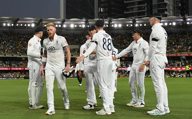 Ben Stokes and the England team leave the field
