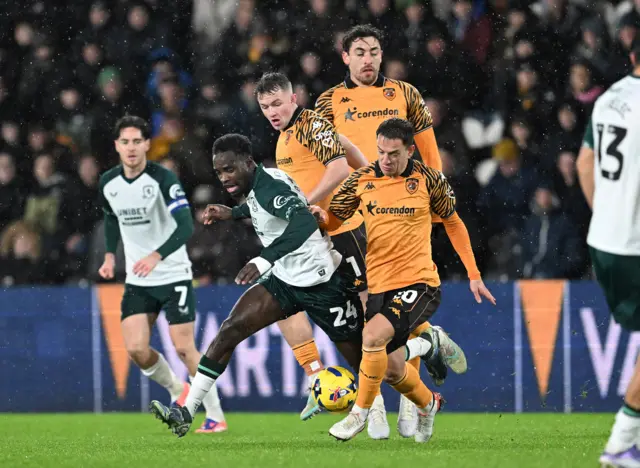 Alex Bangura of Middlesbrough and Amir Hadziahmetovic of Hull City