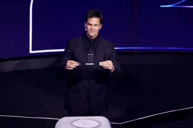 Tom Brady draws France from pot 1 during the 2026 FIFA World Cup draw at the John F. Kennedy Center for the Performing Arts, Washington, United States. Picture date: Friday December 5, 2025.