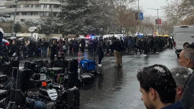 A queue outside the venue in the snow