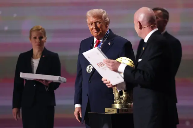 U.S. President Donald Trump receives the FIFA Peace Prize from Gianni Infantino, President of FIFA, during the FIFA World Cup 2026 Official Draw at John F. Kennedy Center for the Performing Arts on December 05, 2025 in Washington, DC.