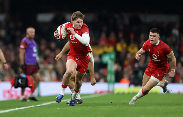 Ellis Mee runs with the ball for Wales against South Africa