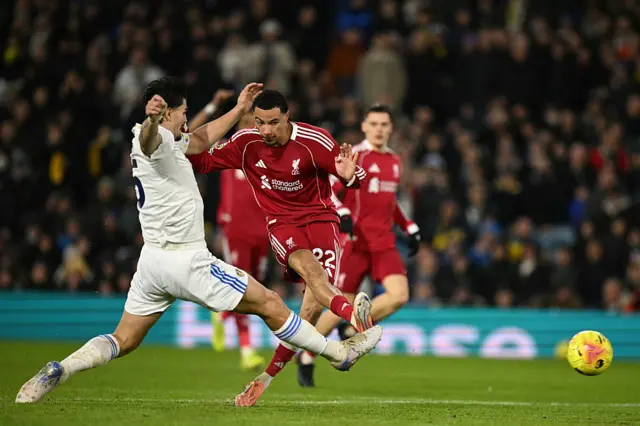 Hugo Ekitike shoots past Leeds United's Dutch defender #05 Pascal Struijk
