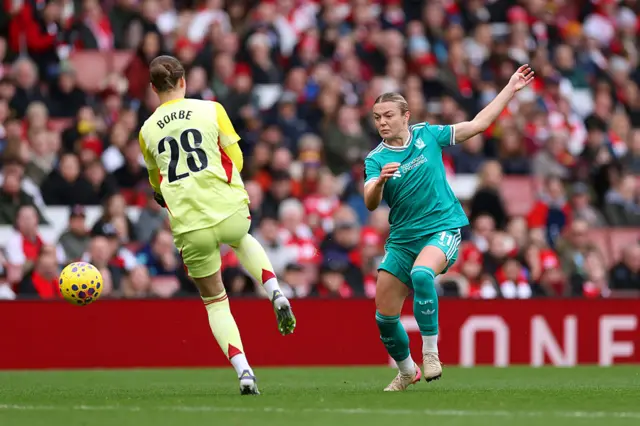 Anneke Borbe of Arsenal saves a shot from Beata Olsson of Liverpool during the Barclays Women's Super League match between Arsenal and Liverpool at Emirates Stadium on December 06, 2025 in London, England.