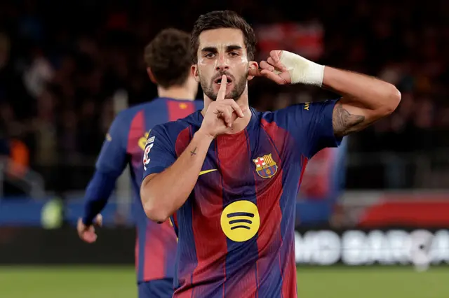 Ferran Torres holds a finger to his lips and puts a finger in his ear