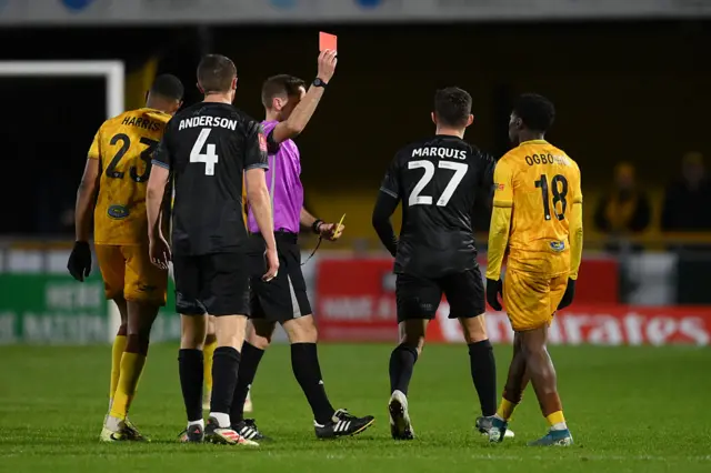 Sutton's David Ogbonna receives a second yellow card and is sent off against Shrewsbury