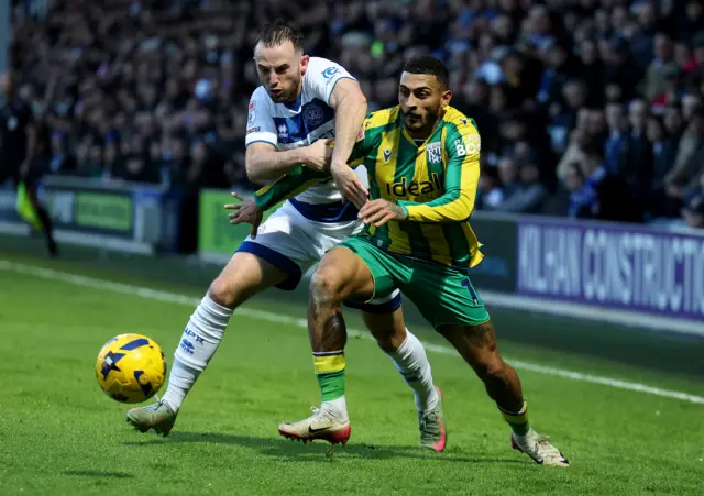 Rhys Norrington-Davies of Queens Park Rangers and Karlan Grant of West Bromwich Albion battle for the ball