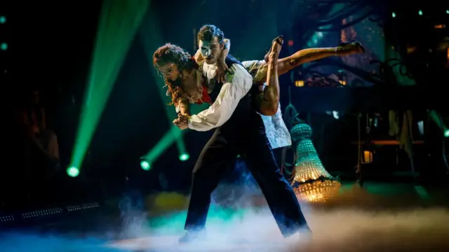 George and Alexis dance as Phantom of the Opera characters