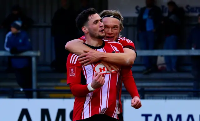 Jack Aitchison celebrates giving Exeter the lead against Wycombe