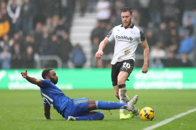 Leicester City's Ricardo Pereira (left) tackles Derby County's Callum Elder