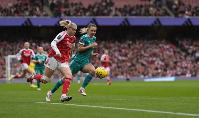 Arsenal's Alessia Russo takes on Liverpool's Gemma Evans during the Barclays Women's Super League match at the Emirates Stadium, London.