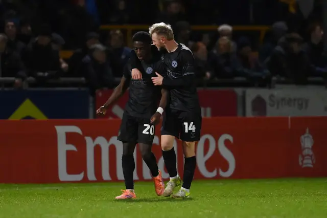 Shrewsbury's Ismeal Kabia celebrates his equaliser at Sutton with Taylor Perry