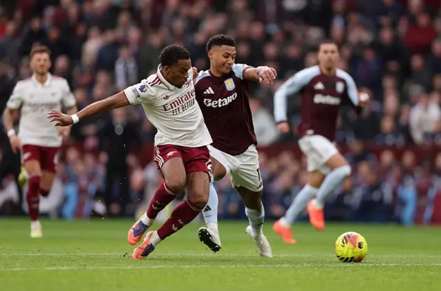 Jurrien Timber of Arsenal and Ollie Watkins