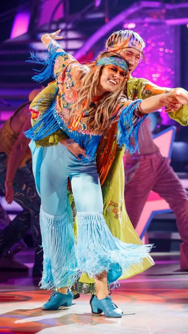 Karen and Carlos dance a Samba in frilly costumes