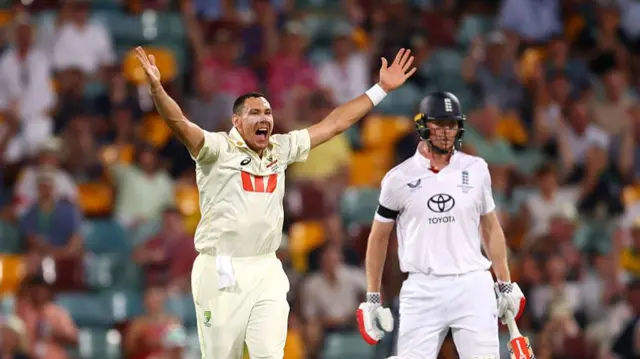 Scott Boland (left) appealing for a wicket