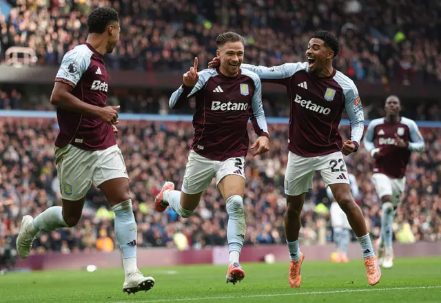Matty Cash celebrating goal with players