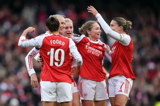 Stina Blackstenius of Arsenal celebrates scoring her team's second goal with teammates Caitlin Foord and Steph Catley during the Barclays Women's Super League match between Arsenal and Liverpool at Emirates Stadium on December 06, 2025 in London, England.