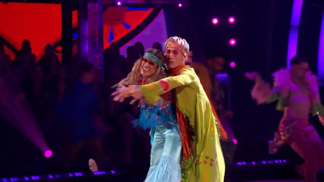Karen and Carlos dressed as hippies on Strictly
