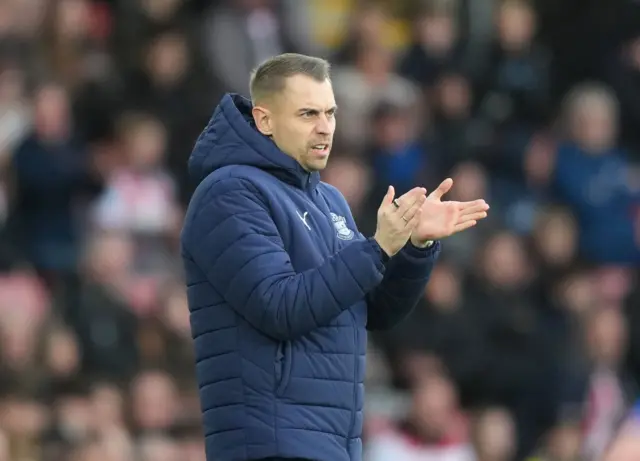 Tonda Eckert manager of Southampton claps encouragement to his team.