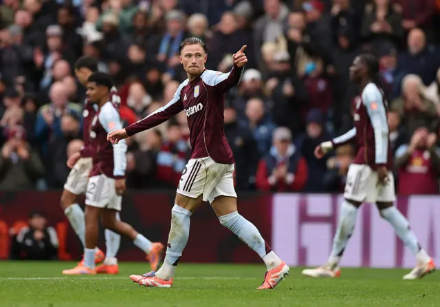 Matty Cash pointing to the crowd after scoring a goal
