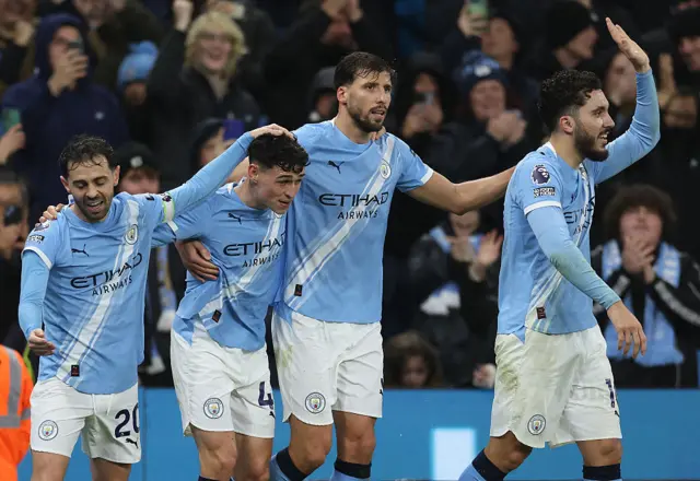 Phil Foden and teammates celebrating after his goal