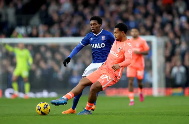 Coventry City's Milan van Ewijk (right) and Ipswich Town's Jaden Philogene-Bidace (left) battle for the ball