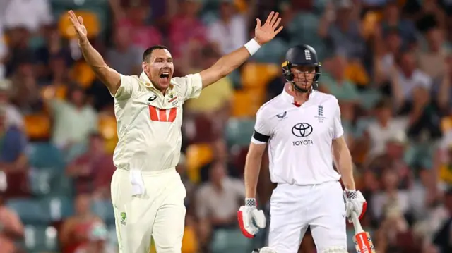 Scott Boland (left) appeals for the wicket of Zak Crawley