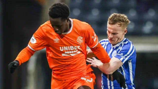 Rangers' Djeidi Gassama and Kilmarnock's Scott Tiffoney