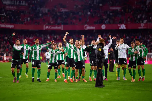 Real Betis players celebrate on the pitch