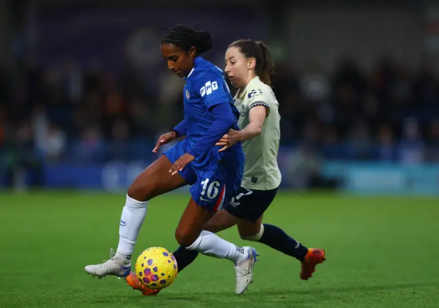 Chelsea's Naomi Girma in action with Everton's Clare Wheeler