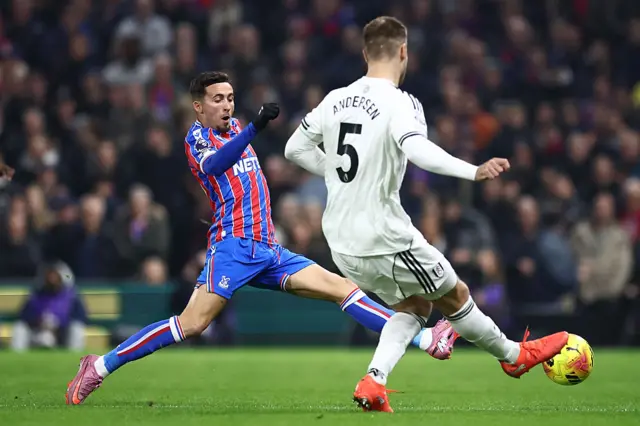 Crystal Palace's Spanish midfielder #10 Yeremy Pino (L) vies with Fulham's Danish defender #05 Joachim Andersen (R) during the English Premier League football match between Fulham and Crystal Palace at Craven Cottage in London on December 7, 2025.