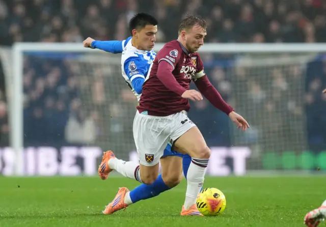 Brighton and Hove Albion's Diego Gomez (rear left) and West Ham United's Jarrod Bowen battle for the ball during the Premier League match at the American Express Stadium, Brighton