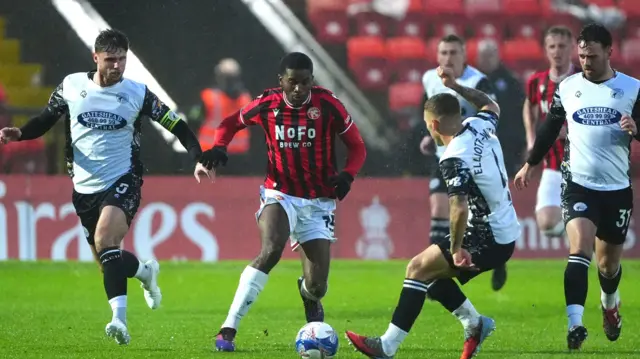 Walsall's Daniel Kanu takes on Gateshead's Aidan Elliott-Wheeler