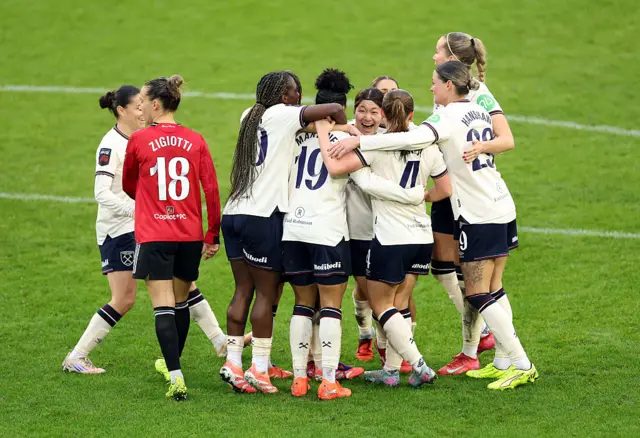 Shekiera Martinez of West Ham United celebrates scoring her team's first goal with teammates during the Barclays Women's Super League match between Manchester United and West Ham United at Progress with Unity Stadium on December 07, 2025 in Leigh, England.
