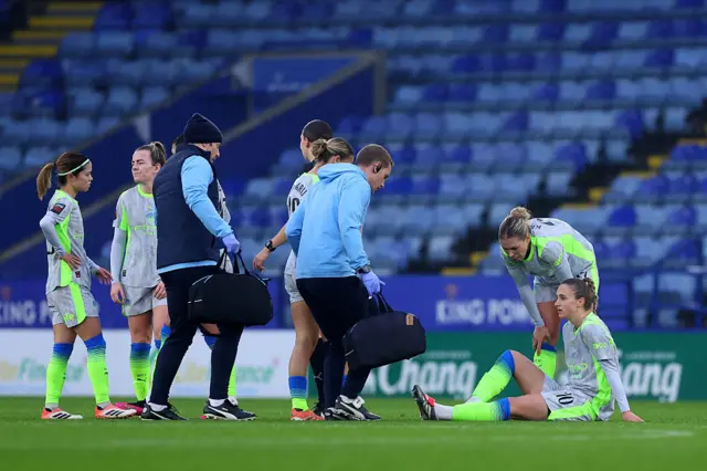 Vivianne Miedema of Manchester City (R) receives medical treatment during the Barclays Women's Super League match between Leicester City and Manchester City at The King Power Stadium on December 07, 2025 in Leicester, England. (