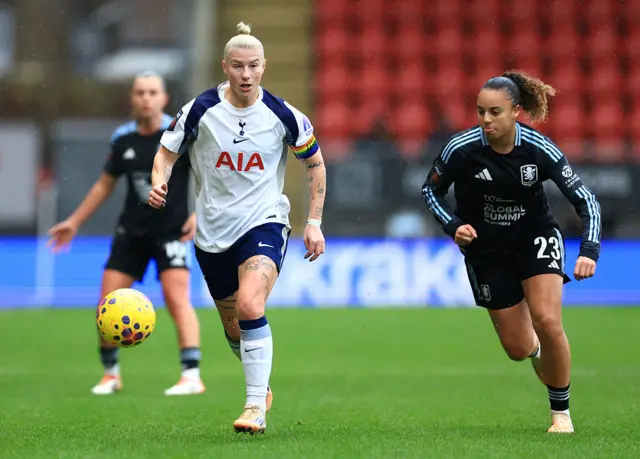 Bethany England of Tottenham Hotspur on the ball whilst under pressure from Chasity Grant of Aston Villa during the Barclays Women's Super League match between Tottenham Hotspur and Aston Villa at BetWright Stadium on December 07, 2025 in London, England.