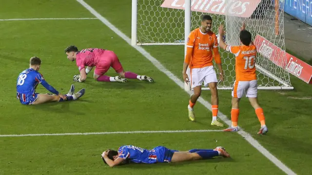 Ashley Fletcher celebrates scoring Blackpool's fourth goal against Carlisle