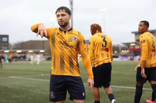 Slough Town's Wiktor Makowski celebrates scoring his side's opening goal from the penalty sport during the FA Cup second round match at Arbour Par