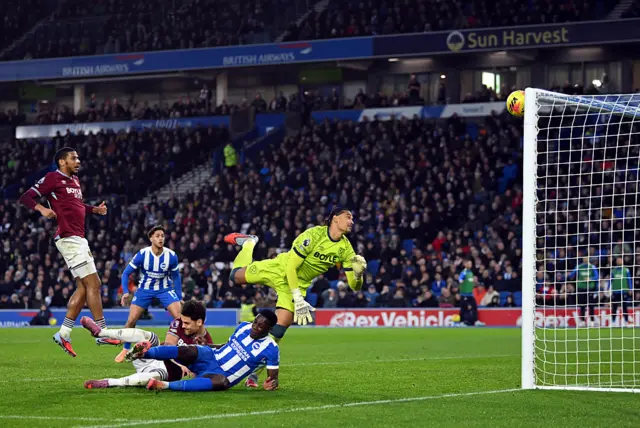 Alphonse Areola of West Ham United makes a save during the Premier League match between Brighton & Hove Albion and West Ham United at Amex Stadium on December 07, 2025 in Brighton, England.