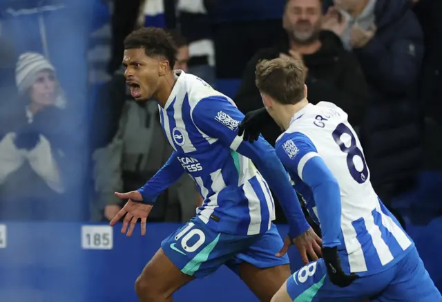 Brighton & Hove Albion's Georginio Rutter celebrates scoring their first goal with Brajan Gruda