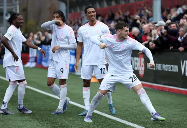 James Edmondson celebrates with his Macclesfield team-mates after giving his side the lead at Slough