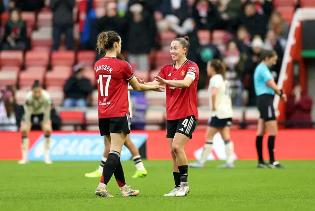 Dominique Janssen and Maya Le Tissier of Manchester United celebrate after the full time whistle at the Barclays Women's Super League match between Manchester United and West Ham United at Progress with Unity Stadium on December 07, 2025 in Leigh, England