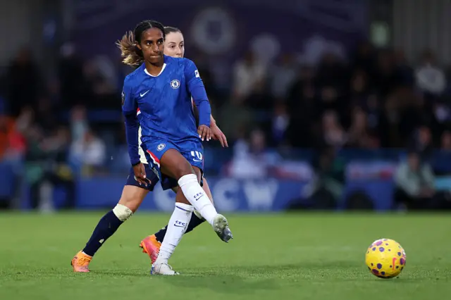 Naomi Girma of Chelsea passes the ball during the Barclays Women's Super League match between Chelsea FC and Everton at Kingsmeadow on December 07, 2025 in Kingston upon Thames, England.