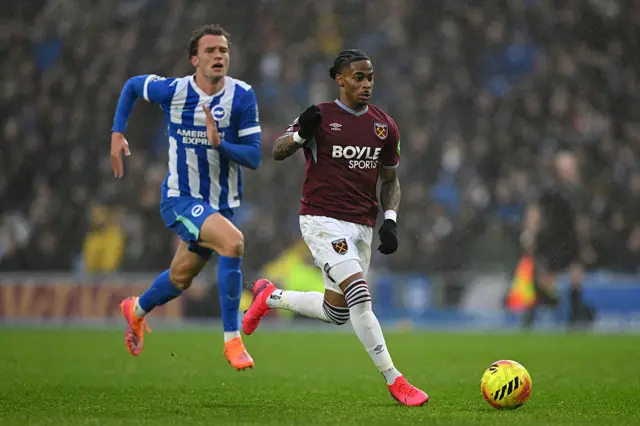 Crysencio Summerville of West Ham United is put under pressure by Mats Wieffer of Brighton & Hove Albion during the Premier League match between Brighton & Hove Albion and West Ham United at Amex Stadium on December 07, 2025 in Brighton, England