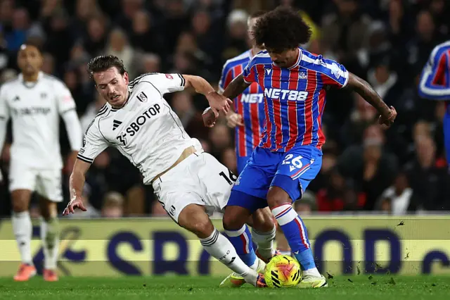 ulham's Norweigan midfielder #16 Sander Berge (L) vies with Crystal Palace's US defender #26 Chris Richards (R) during the English Premier League football match between Fulham and Crystal Palace at Craven Cottage in London on December 7, 2025.