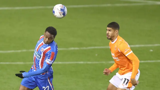 Josh Williams of Carlisle United and Ashley Fletcher of Blackpool